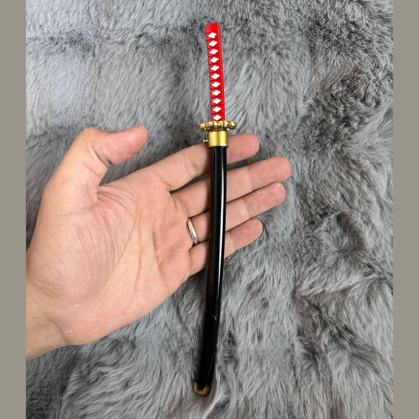 The Demonslayer and One Piece swords with pin control